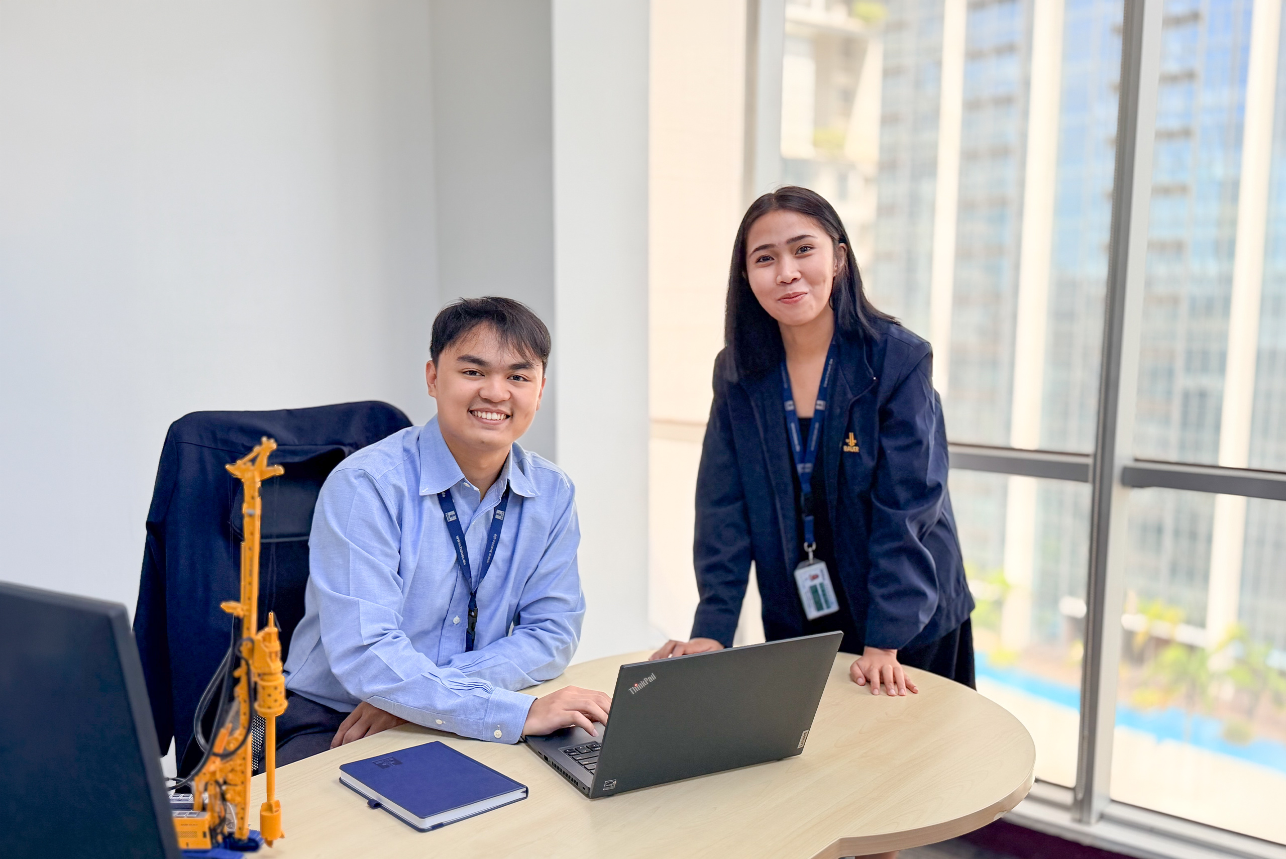 Man and woman working as colleagues together in the office.
