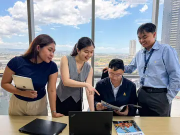 Employees of Bauer Foundations Philippines working on a project in the office.